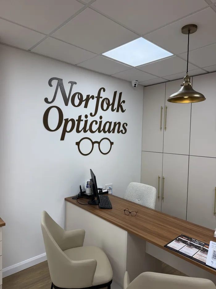 Norfolk Opticians lettering above the consultation desk
