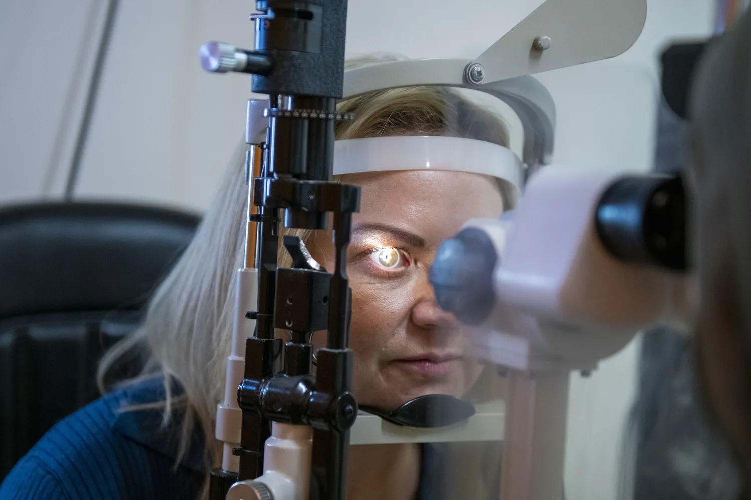 A patient's eye examined under the slit lamp at Norfolk Opticians